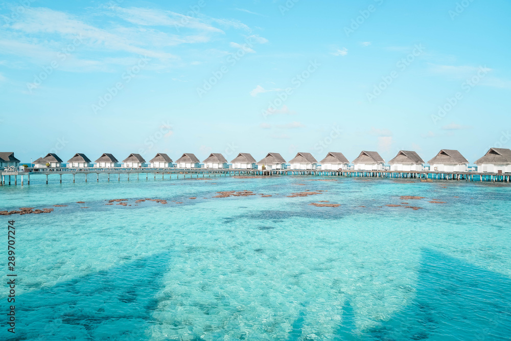 Beautiful Landscape of Over ocean Tropical beach summer resort hotel and spa, Maldives island with sea and sky tranquil for holiday vacation