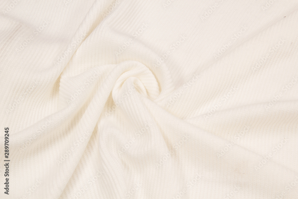 Knitted wool Jersey is white. The texture of a knitted sweater Knitted wool Jersey is white. The texture of a knitted sweater