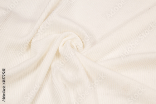 Knitted wool Jersey is white. The texture of a knitted sweater