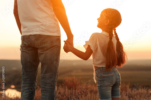 Принти на полотні Happy daughter with father enjoying sunset in nature