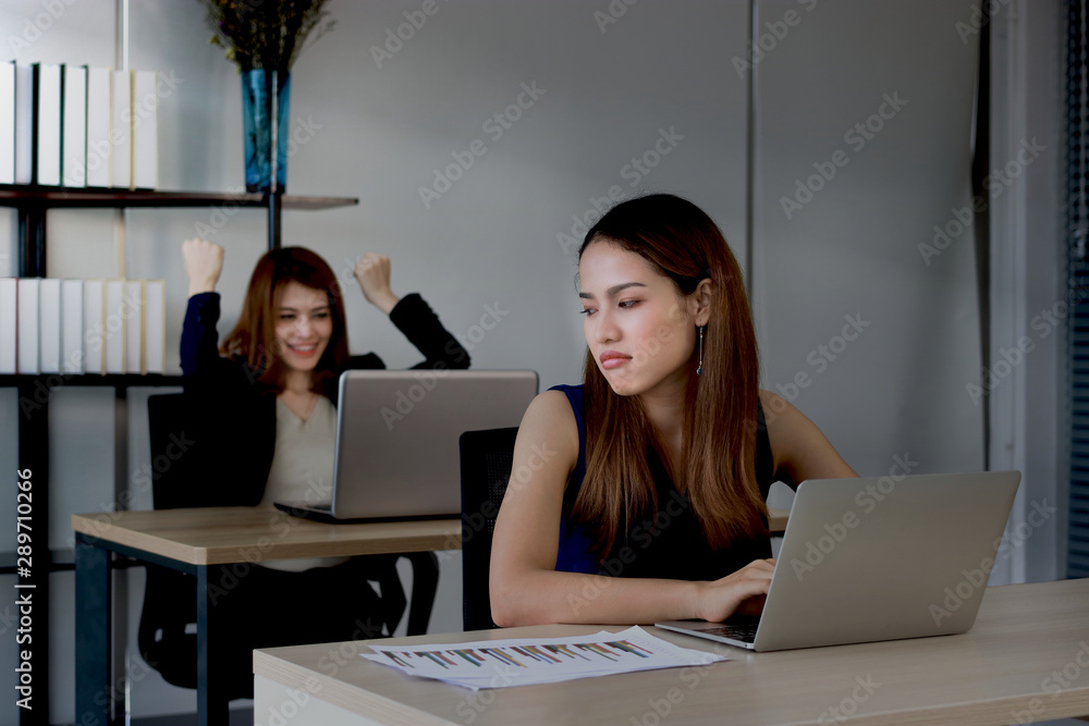 Εκτύπωση καμβά Angry envious Asian business woman looking successful competitor colleague in office