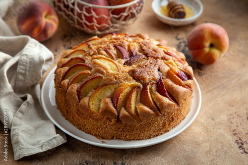 peach cake  on wooden table photo