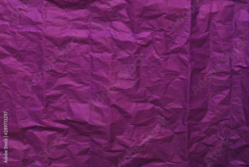 Purple crumpled paper texture background. Top view