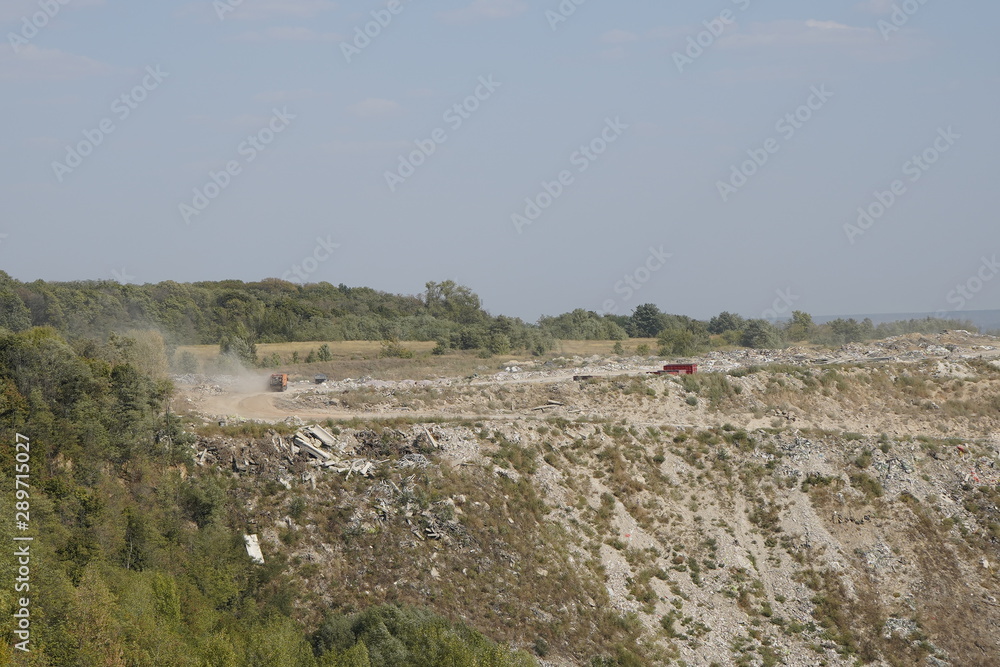 Kiev, Ukraine, Europe - September 2019: Landfill of building materials. Ecology, environmental pollution. Landfill waste. Garbage in the woods.