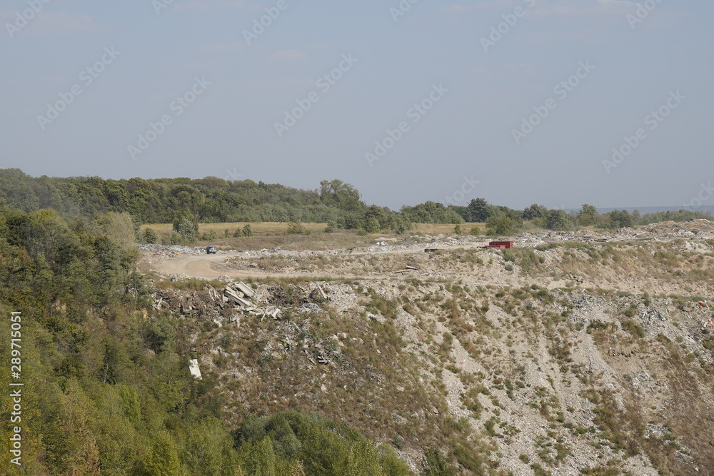 Kiev, Ukraine, Europe - September 2019: Landfill of building materials. Ecology, environmental pollution. Landfill waste. Garbage in the woods.