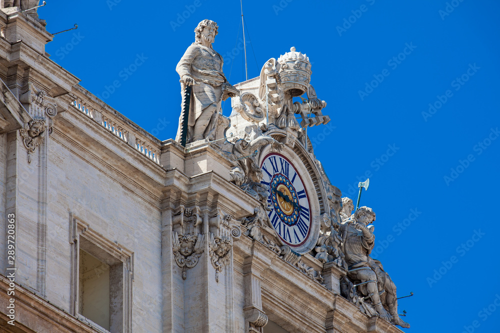 Detail of one of the clocks that crown the St. Peter Basilica on the Vatican City