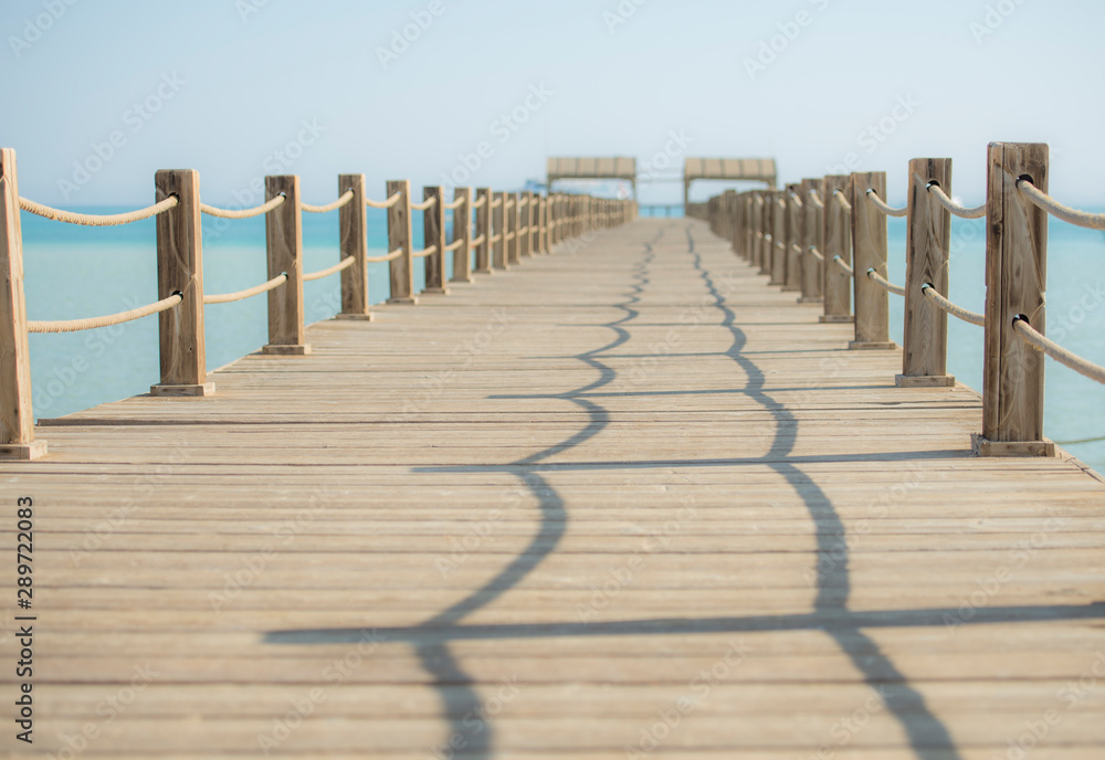 Fototapeta premium View along large wooden jetty on tropical island