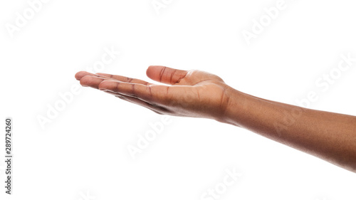 Outstretched female hand, empty palm over white background photo