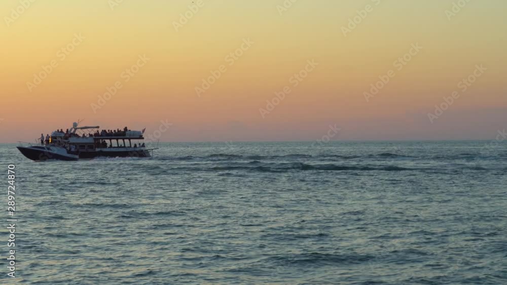 Colorful sunset above the sea surface with sailing yachts, Colorful sunset above the sea surface with sailing yachts,