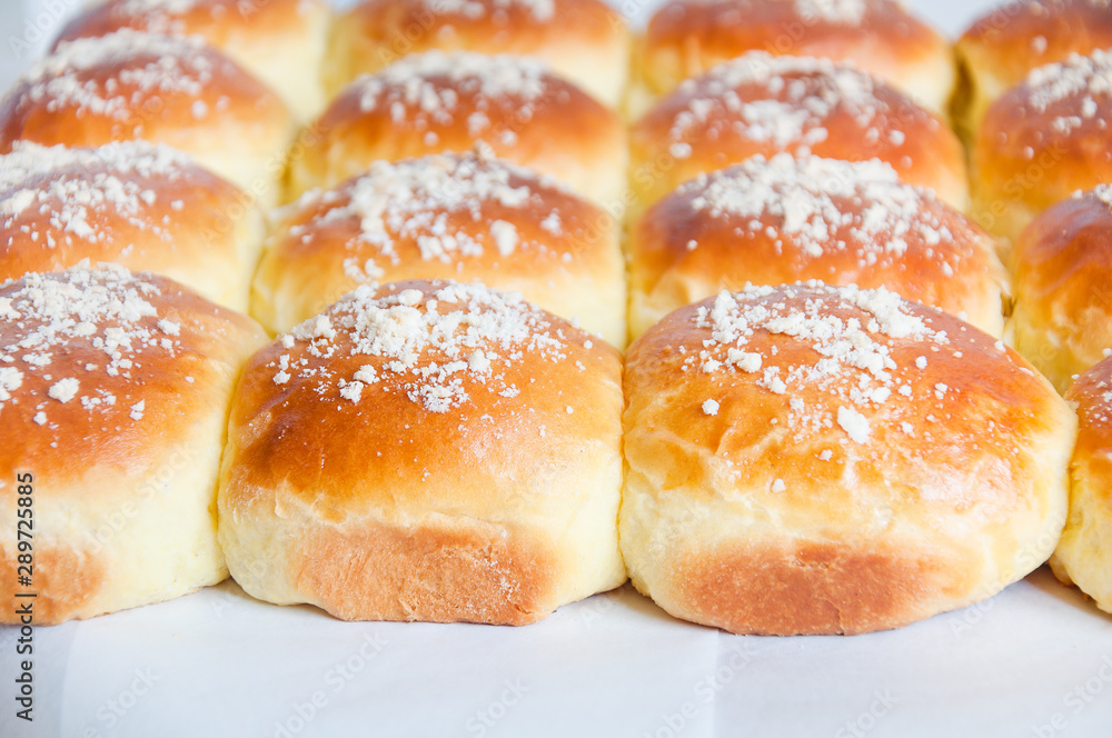 Freshly baked buns with white sprinkle