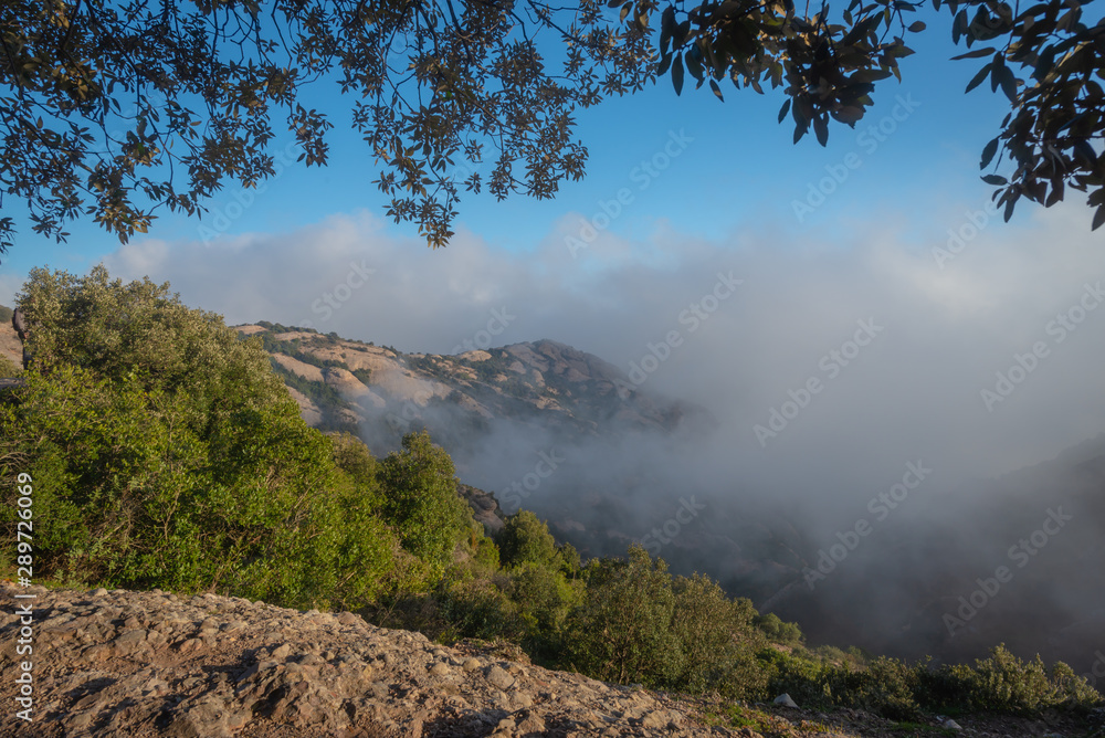 Mountain view and incoming fog near the abbey of Montserrat, Marganell, Spain