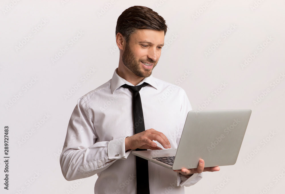 Businessman Working On Laptop Over White Background Businessman Working On Laptop Over White Background