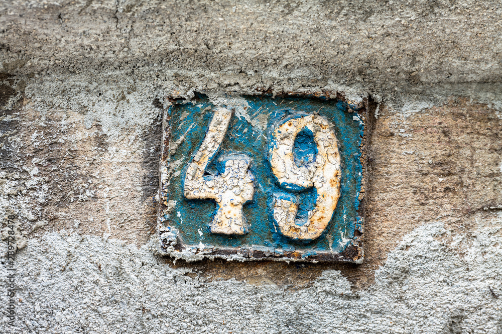 Street number sign on the wall Street number sign on the wall