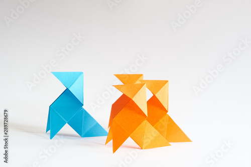 Free Download Photograph of a blue paper bow tie, followed by three orange paper bow ties, with a white background. Space for text. Ideal for presentations. For background. - GFXLoad