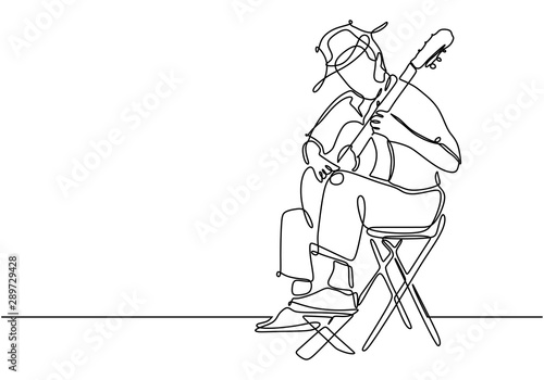 Continuous line music theme of person playing classical guitar acoustic instrument. Minimalism style of single hand drawn simplicity style design.