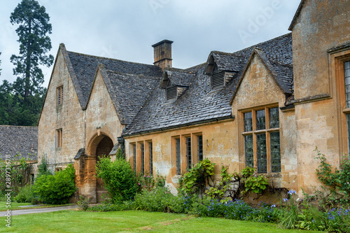 STANWAY, ENGLAND - MAY, 26 2018: Stanway Manor House built in Jacobean period architecture 1630 in guiting yellow stone, in the Cotswold village of Stanway, Gloucestershire, Cotswolds, UK 