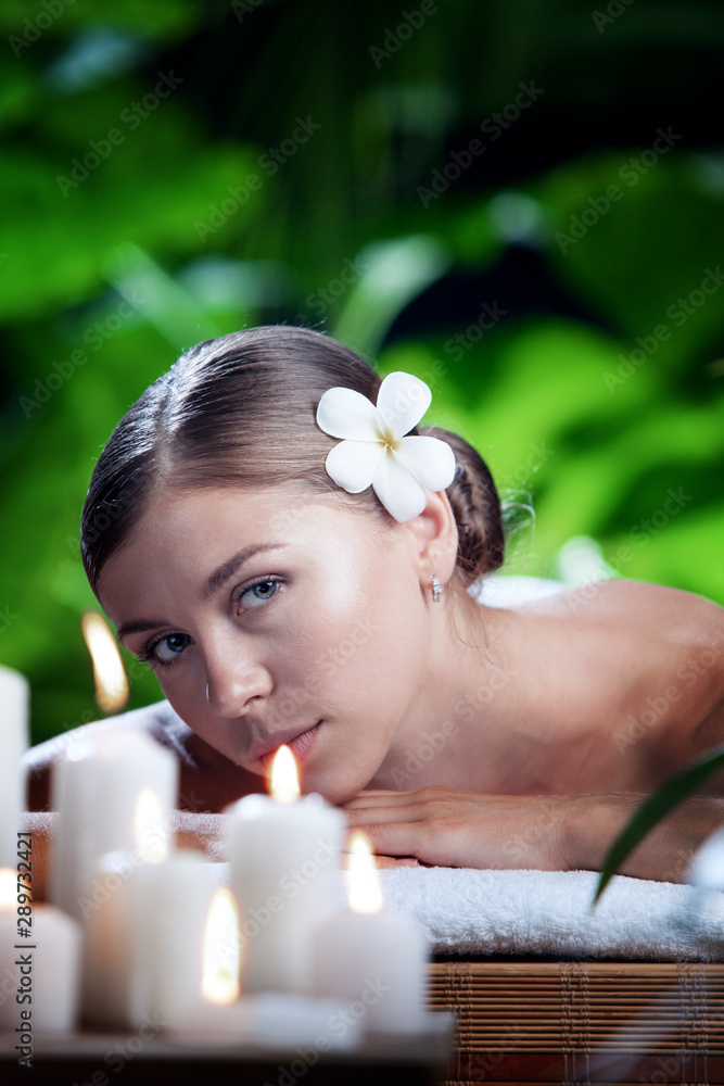 portrait of young beautiful woman in spa environment. portrait of young beautiful woman in spa environment.