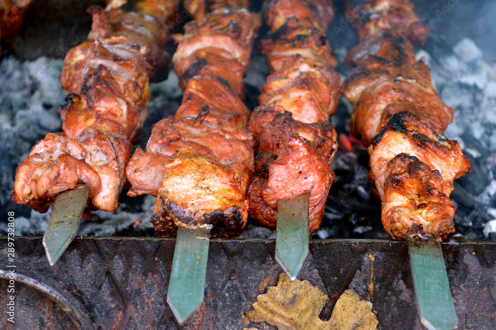 charcoal grill and skewered meat