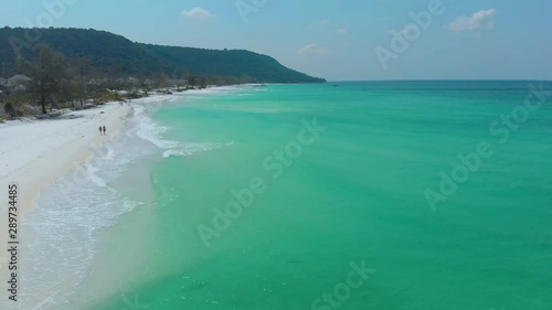 Koh Rong Long Beach. Drone fly over endless white sand beach and turqoise water in a tropical paradise in Cambodia photo