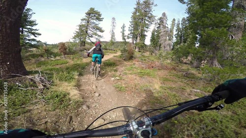 Follow Cam Of Cyclist Riding A Trail