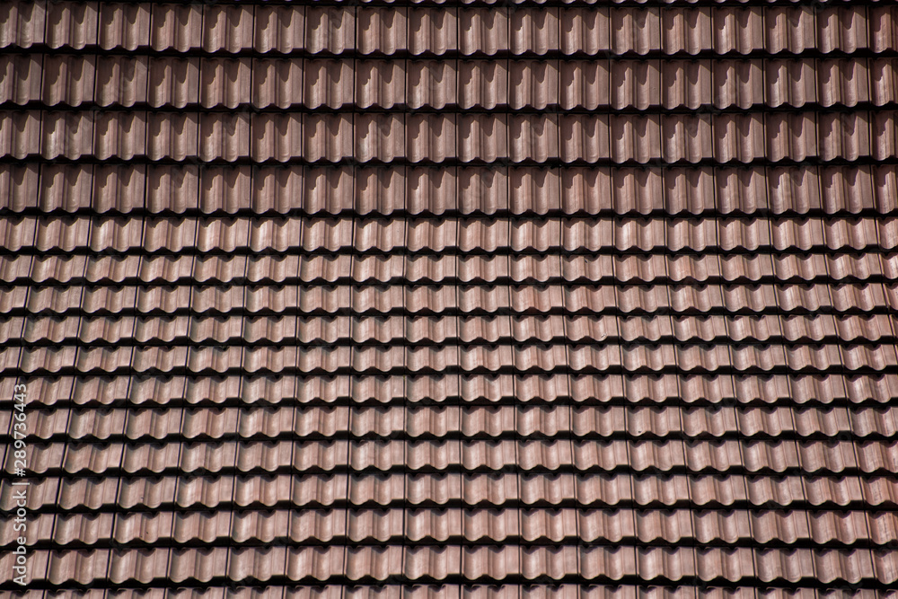 Tile roof made of clay tiles. Backgrounds and textures Tile roof made of clay tiles. Backgrounds and textures