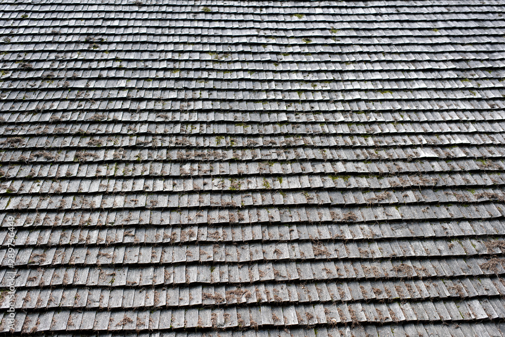 Old roof made of gray wooden planks. Backgrounds and textures Old roof made of gray wooden planks. Backgrounds and textures
