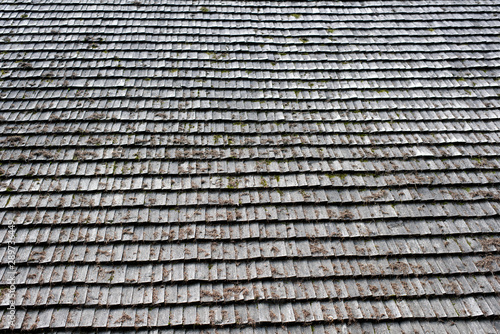 Old roof made of gray wooden planks. Backgrounds and textures