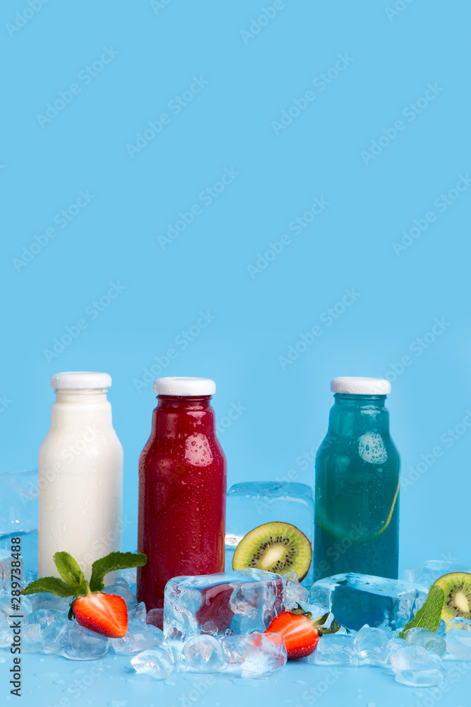 Healthy detox drinks of fresh ingredients on blue background Healthy detox drinks of fresh ingredients on blue background
