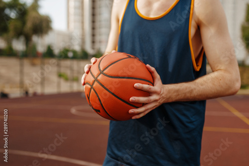 Basketball player aiming for throw  outdoor court
