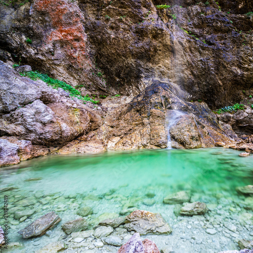 Parabola Waterfall of River Koritnica in Triglav National Park. Log pod Mangartom, Bovec, Slovenia. Europe. photo