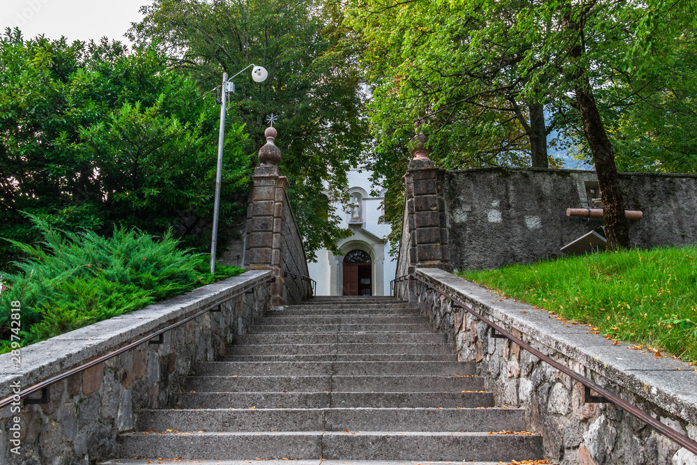 Entrance Steps to Main Church, Župnijska cerkev sv. Urha in Bovec, Flitsch, Slovenia, Europe.