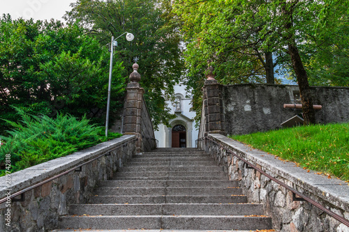 Entrance Steps to Main Church, Župnijska cerkev sv. Urha in Bovec, Flitsch, Slovenia, Europe. © unununius