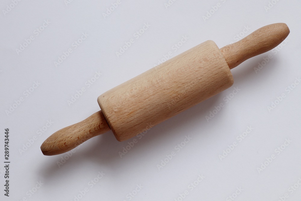 Close-up of rolling pin on white background Close-up of rolling pin on white background