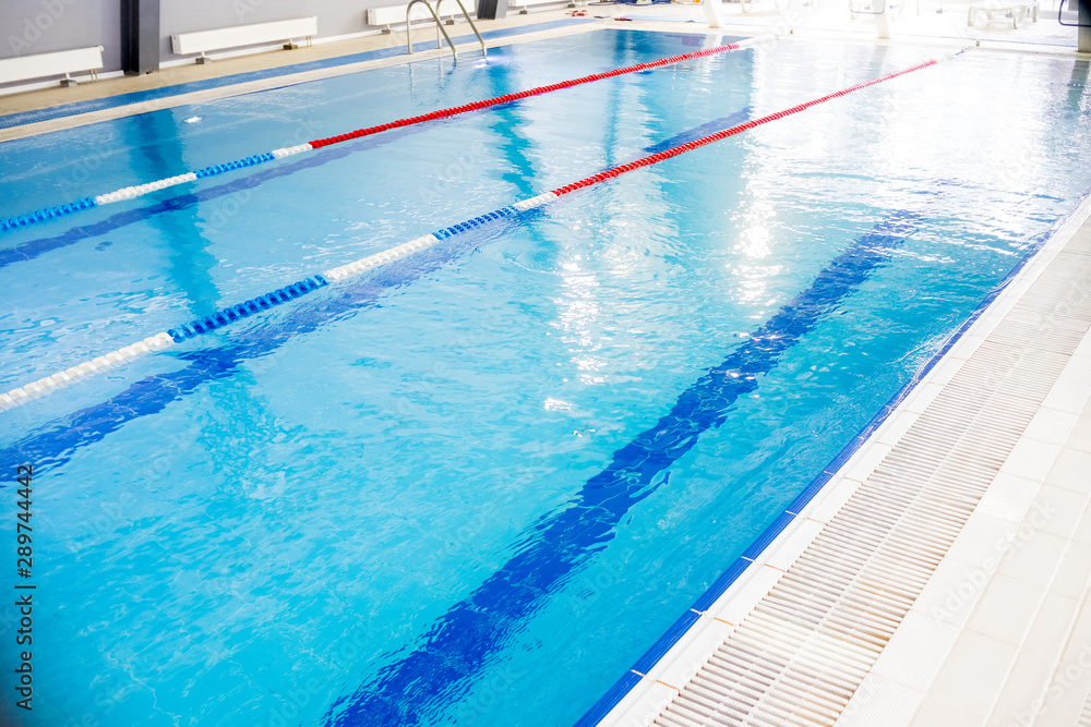 Indoor swimming pool, healthy concept.swiming pool for competition.pool with swim lanes. sport and enjoyment. Relaxation,recreation and sports training