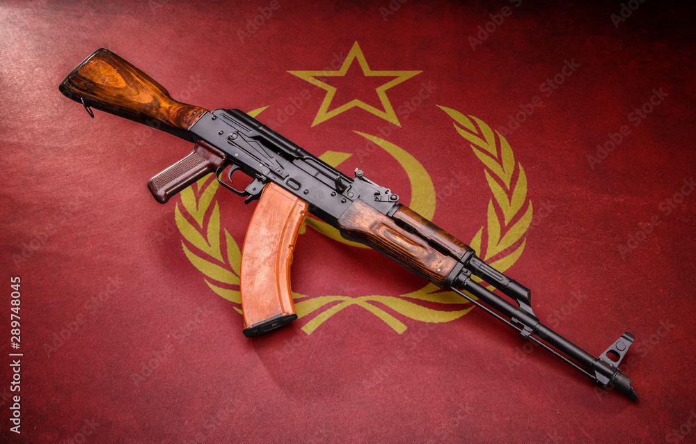 Russian AK47 on Russian flag background. Stock Photo Adobe Stock