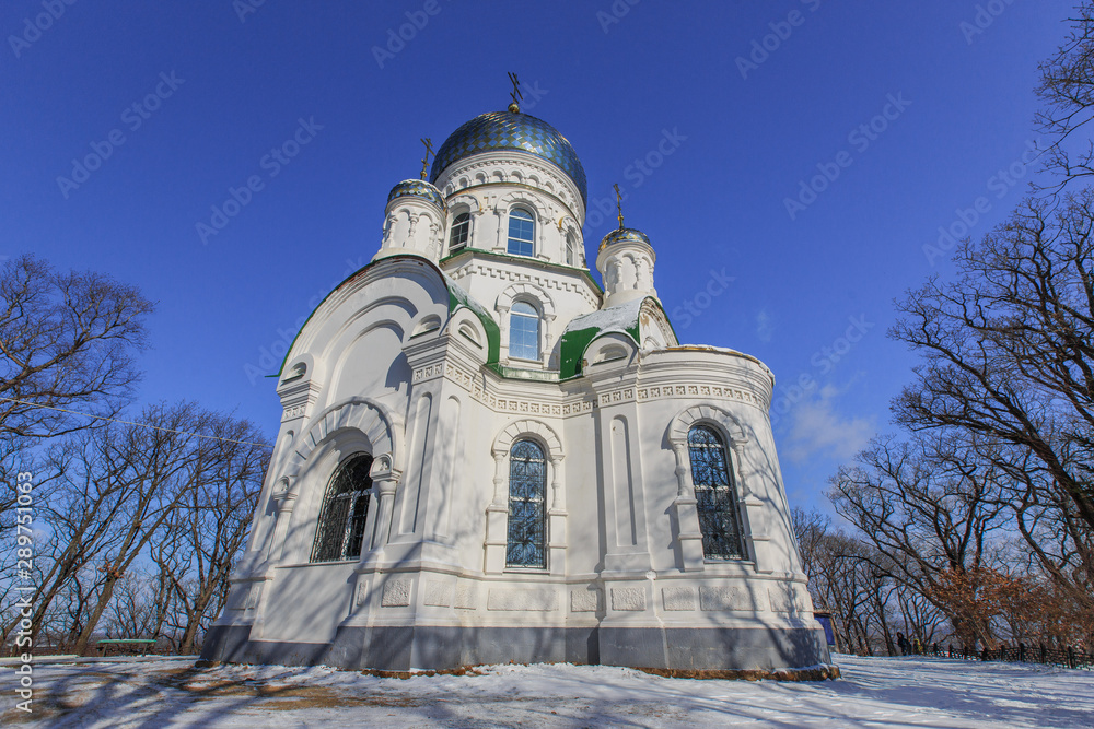 Beautiful Orthodox church in the winter at the top of the hill