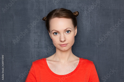Portrait of pensive girl with funny hairstyle © Andrei Korzhyts