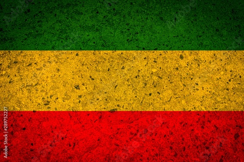 Green yellow red reggae background on concrete wall texture