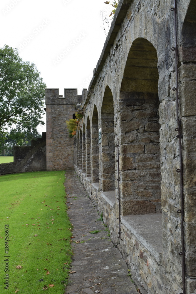 Old castle walls with arches