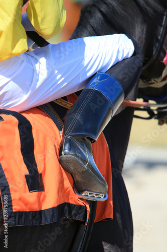 Horse racing jockey in saddle details