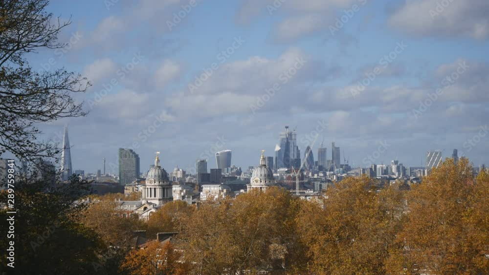 A view of London from a hill in autumn park. A view of London from a hill in autumn park.