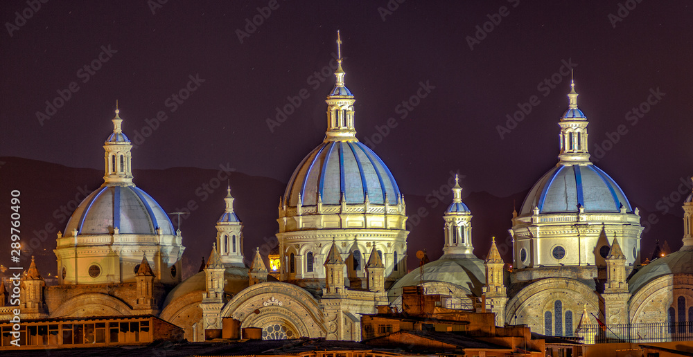 Domes of New Cathedral in Cuenca, Ecuador are lit at night