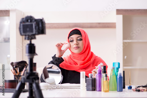 Beauty blogger in hijab recording video for her blog