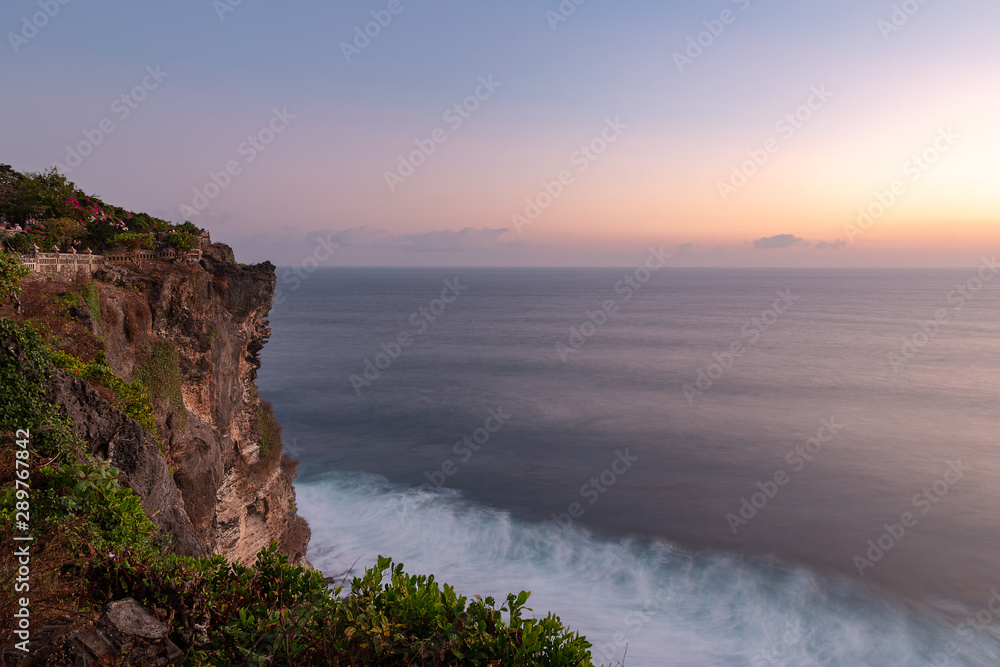 Sunset view over the sea from Uluwatu temple, Bali island