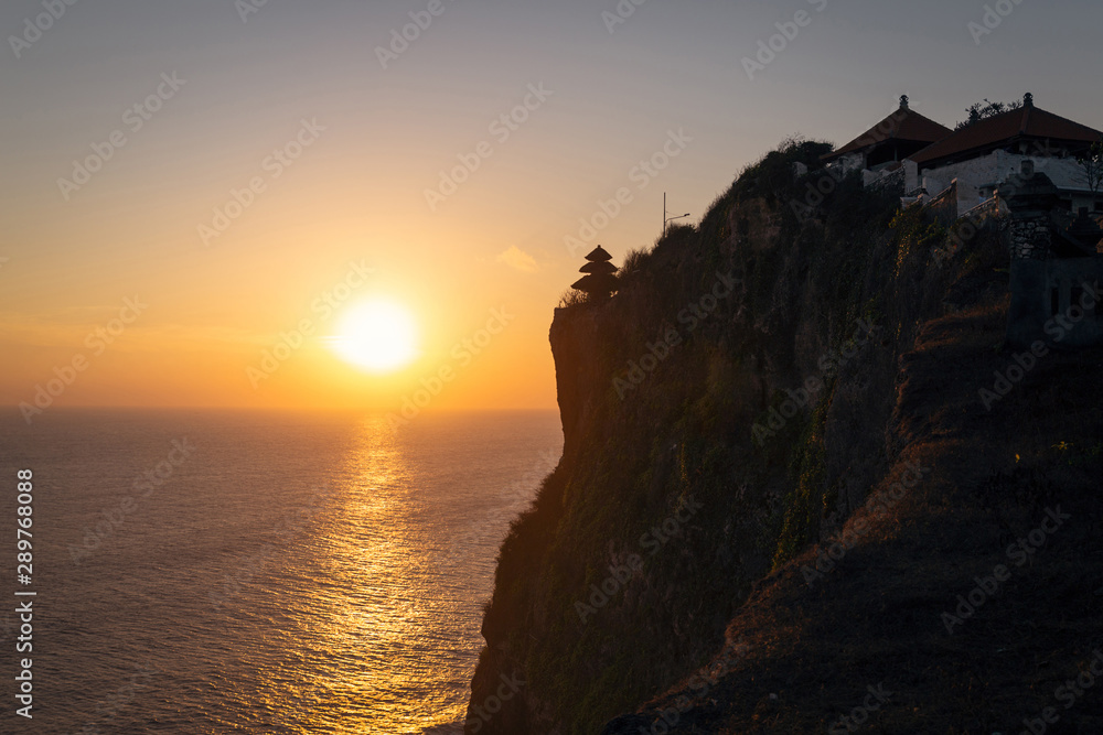 Sunset view over the sea from Uluwatu temple, Bali island Sunset view over the sea from Uluwatu temple, Bali island