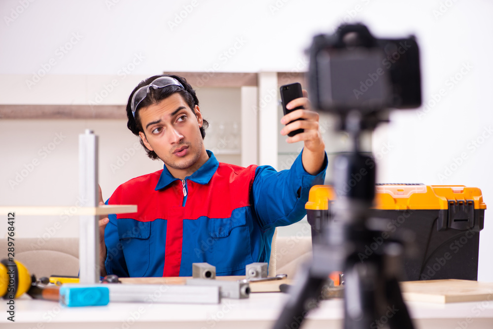 Young contractor recording video for his blog Young contractor recording video for his blog