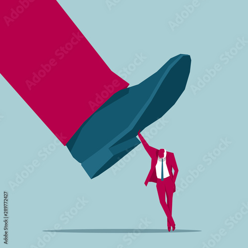 The businessman supports huge legs with one hand. Isolated on blue background.