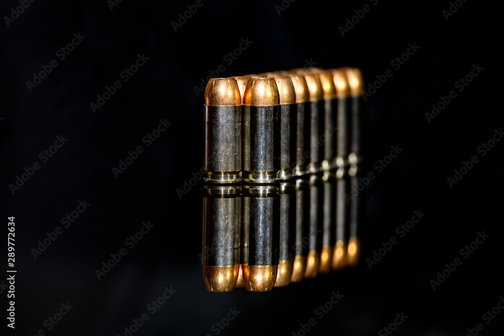 40 Caliber hollow point ammunition on black background 40 Caliber hollow point ammunition on black background