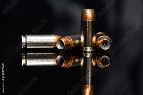 40 Caliber hollow point ammunition on black background photo