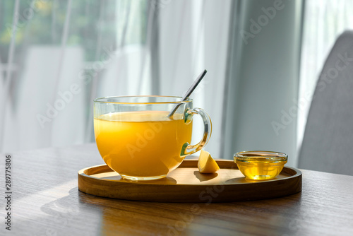 Hot winter tea from sea buckthorn. A cup of hot scented tea with sea buckthorn, honey and orange. Hot tonic drink in flu